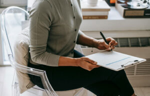 Integrative health consultation at Nayeli Integrative Health Clinic – practitioner drafting a personalized wellness plan.