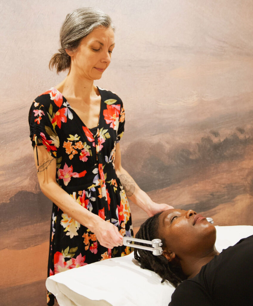 Dr Rachel Eni performing facial acupuncture on a client during a microneedling session at Nayeli Integrative Health Clinic, Colwood BC